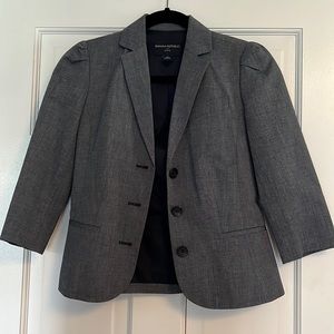 Grayish blue cropped blazer with a puffed shoulder